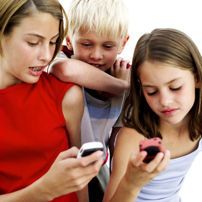 three children using cell phones