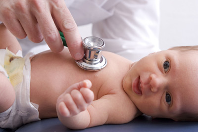 Doctor listening to baby's chest