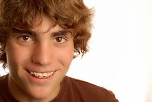 young man with braces on his teeth