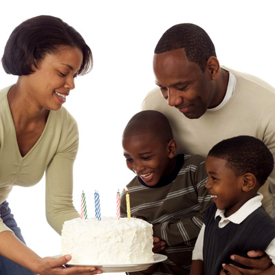 mother, father, and 2 sons at birthday party